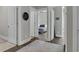 Open hallway leading to a bedroom showcasing light walls and hardwood floors at 1584 Sand Harbor Cir. # 1584, Ocean Isle Beach, NC 28469