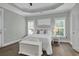 Inviting main bedroom with ample natural light, tray ceiling, and neutral decor at 1584 Sand Harbor Cir. # 1584, Ocean Isle Beach, NC 28469
