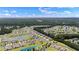Panoramic aerial shot of the expansive residential community with multiple ponds and lush landscaping at 2131 Cass Lake Dr. # 662, Carolina Shores, NC 28467