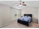Bedroom with a bed, ceiling fan, carpeted floors, and a large window with natural light at 2131 Cass Lake Dr. # 662, Carolina Shores, NC 28467