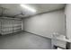 Spacious garage with overhead lighting, sink, and ample room for parking and storage at 2131 Cass Lake Dr. # 662, Carolina Shores, NC 28467