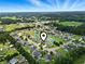 An aerial view of the residential area and the surrounding landscape with pond at 232 White Water Loop, Conway, SC 29526