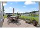 Back patio featuring outdoor dining set and a beautiful pond view with fountain at 232 White Water Loop, Conway, SC 29526