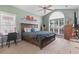 Bright bedroom featuring a large window, vaulted ceiling, and a comfortable queen-size bed with cozy linens at 232 White Water Loop, Conway, SC 29526