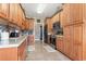 Traditional kitchen with light wood cabinets, tile backsplash, stainless steel appliances, and tile floors at 232 White Water Loop, Conway, SC 29526