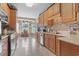 Spacious kitchen with tile floors, light wood cabinets, stainless steel appliances, and backsplash at 232 White Water Loop, Conway, SC 29526