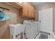Laundry room with sink, washer, dryer, and upper cabinets at 232 White Water Loop, Conway, SC 29526