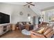 Spacious living room with vaulted ceilings, leather furniture, wood flooring, and ample natural light at 232 White Water Loop, Conway, SC 29526