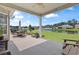 Covered patio overlooking a pond with outdoor seating at 232 White Water Loop, Conway, SC 29526