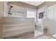 Modern walk-in shower featuring stylish tilework, a rainfall showerhead, and a built-in bench for relaxation at 232 White Water Loop, Conway, SC 29526