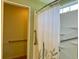 View of the shower with grab bars and a shower curtain at 233 Melody Gardens Dr., Surfside Beach, SC 29575