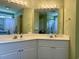 Bright bathroom featuring double sinks and a large mirror at 233 Melody Gardens Dr., Surfside Beach, SC 29575