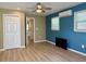 Bedroom featuring wood laminate flooring and a split-unit air conditioner at 233 Melody Gardens Dr., Surfside Beach, SC 29575