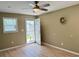 Neutral bedroom featuring a ceiling fan and access to the exterior at 233 Melody Gardens Dr., Surfside Beach, SC 29575