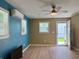 Bedroom with a ceiling fan, wood laminate flooring, and split-unit air conditioner at 233 Melody Gardens Dr., Surfside Beach, SC 29575