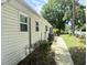 Exterior view of home featuring vinyl siding and a landscaped yard at 233 Melody Gardens Dr., Surfside Beach, SC 29575