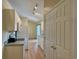 Bright kitchen with white cabinets and appliances visible from hallway at 233 Melody Gardens Dr., Surfside Beach, SC 29575