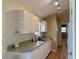 Cozy kitchen featuring white cabinets and laminate countertops at 233 Melody Gardens Dr., Surfside Beach, SC 29575