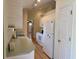 Well-lit kitchen featuring white appliances, white cabinets, and laminate countertops at 233 Melody Gardens Dr., Surfside Beach, SC 29575
