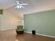 Open living room with vaulted ceilings, a ceiling fan, and wood laminate flooring at 233 Melody Gardens Dr., Surfside Beach, SC 29575