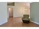 Bright living room featuring high ceilings, chandelier, and wood-look laminate flooring at 233 Melody Gardens Dr., Surfside Beach, SC 29575