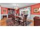 Formal dining room with hardwood floors, chandelier, and a large window overlooking the yard at 241 Black Duck Rd., Pawleys Island, SC 29585