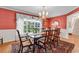Elegant dining room with hardwood floors, chandelier, and large windows for plenty of natural light at 241 Black Duck Rd., Pawleys Island, SC 29585