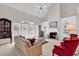Bright living room with vaulted ceiling, fireplace, built-ins, and French doors to the outside at 241 Black Duck Rd., Pawleys Island, SC 29585