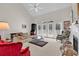 Spacious living room featuring a high ceiling, fireplace, and large windows for natural light at 241 Black Duck Rd., Pawleys Island, SC 29585