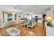 Spacious living area featuring hardwood floors, white walls, and an open kitchen concept at 241 Black Duck Rd., Pawleys Island, SC 29585