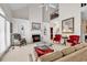 Inviting living room with fireplace, built-in shelving, and a view of the staircase at 241 Black Duck Rd., Pawleys Island, SC 29585