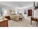 Serene main bedroom with floral bedding, neutral walls, and abundant natural light at 241 Black Duck Rd., Pawleys Island, SC 29585
