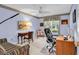 Inviting home office with blue walls, decorative border, a ceiling fan, and a window view at 241 Black Duck Rd., Pawleys Island, SC 29585
