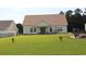 Spacious backyard featuring a well-manicured lawn, perfect for outdoor activities and relaxation at 242 Four Mile Rd., Conway, SC 29526