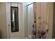 Tiled bathroom with shower/tub combo and stylish butterfly shower curtain at 242 Four Mile Rd., Conway, SC 29526