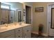 Bathroom offers double vanity and framed mirrors with a tiled walk-in shower at 242 Four Mile Rd., Conway, SC 29526