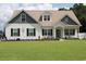 Charming two-story home with a well-manicured lawn and inviting curb appeal with flower beds at 242 Four Mile Rd., Conway, SC 29526