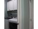 Convenient laundry room boasts matching washer and dryer and upper cabinets at 242 Four Mile Rd., Conway, SC 29526