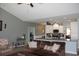 Open-concept living room with adjacent kitchen, stainless appliances, and granite counters at 242 Four Mile Rd., Conway, SC 29526