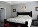 Spacious main bedroom features a tray ceiling, comfortable bed, and warm paint at 242 Four Mile Rd., Conway, SC 29526