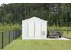 Durable outdoor storage shed with ample space, nestled within a fenced yard and manicured lawn at 242 Four Mile Rd., Conway, SC 29526