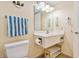 Cozy bathroom featuring a single vanity, ample lighting, and coastal themed wall decor at 2501 S Ocean Blvd. # 503, Myrtle Beach, SC 29577
