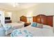Bright bedroom with two beds, stylish headboards, and ceiling fan at 2501 S Ocean Blvd. # 503, Myrtle Beach, SC 29577