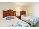Bedroom with two beds, decorative pillows, and classic wooden headboards at 2501 S Ocean Blvd. # 503, Myrtle Beach, SC 29577