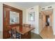 Cozy dining area with wooden table and chairs, next to a built-in cabinet that reflects the kitchen at 2501 S Ocean Blvd. # 503, Myrtle Beach, SC 29577
