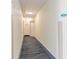 A view down a condo hallway with carpet, light-colored walls, and unit numbers visible at 2501 S Ocean Blvd. # 503, Myrtle Beach, SC 29577