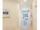Hallway with tile flooring, white walls, and an ocean view visible from the end of the hall at 2501 S Ocean Blvd. # 503, Myrtle Beach, SC 29577