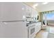 Bright kitchen with white appliances, cabinets, and an ocean view at 2501 S Ocean Blvd. # 503, Myrtle Beach, SC 29577