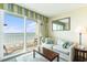 Living room featuring a sofa, coffee table, and a balcony with ocean views at 2501 S Ocean Blvd. # 503, Myrtle Beach, SC 29577