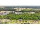 Aerial view of a residential neighborhood surrounded by lush greenery and mature trees at 2529 Hunters Trail, Myrtle Beach, SC 29588